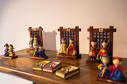 Dolls dressed in traditional Hanbok wedding costumes at Inko gift shop