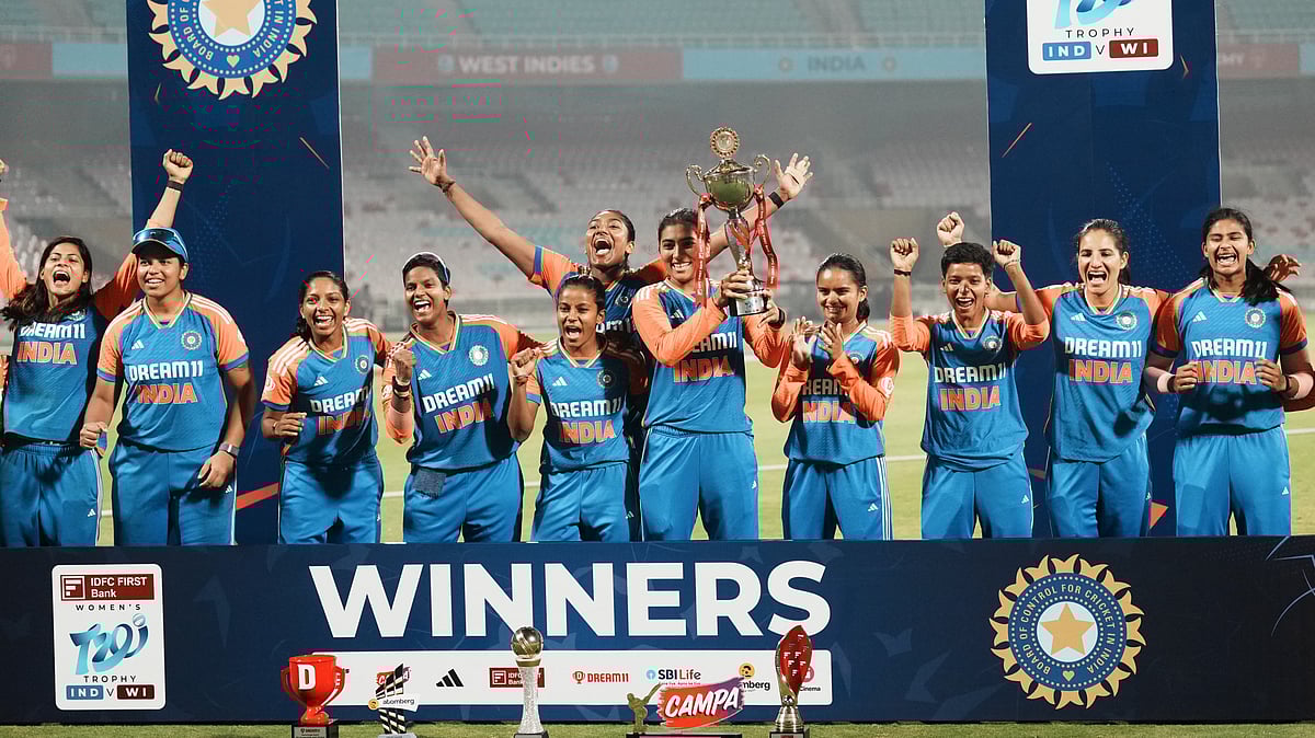 PTI : India celebrate with the trophy after winning the T20I series against West Indies in Navi Mumbai.