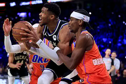 NBA Cup Final: Bucks forward Giannis Antetokounmpo (34) drives against Oklahoma City Thunder guards
