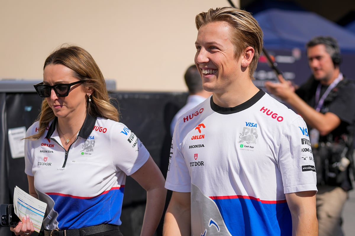 (AP Photo/Darko Bandic) : RB driver Liam Lawson of New Zealand walks through paddock ahead of the Formula One Abu Dhabi Grand Prix, at the Yas Marina Circuit in Abu Dhabi, UAE, Thursday, Dec. 5, 2024. 