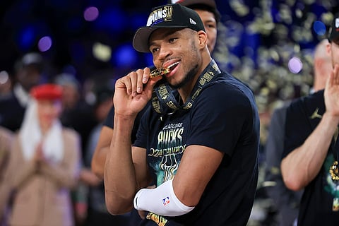 NBA Cup Final: Bucks forward Giannis Antetokounmpo (34) bites his NBA Cup medal