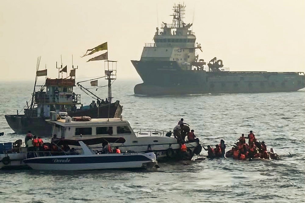 | Photo: PTI : Passengers were rescued after a ferry capsized