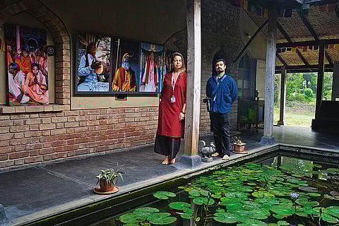 Eva Zanettin and Raghav Pasricha in front of their exhibit on the Bauls and fakirs