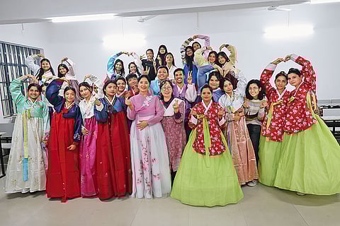 Keen Learners: Students dressed in Hanbok— traditional Korean attire—in the Korean language class at Patna’s A.N. College along with their teachers, Grace Lee and Sunny