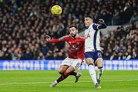 EFL Cup Quarter-Finals: Tottenham's Pedro Porro challenges for the ball with Manchester United's Bruno Fernandes