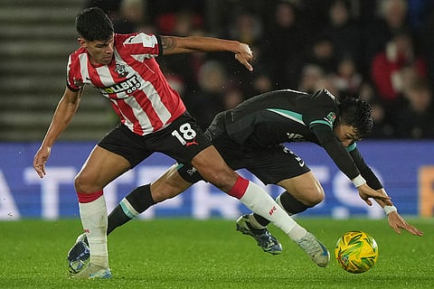 EFL Cup Quarter-Finals: Southampton's Mateus Fernandes and Liverpool's Wataru Endo fight for the ball