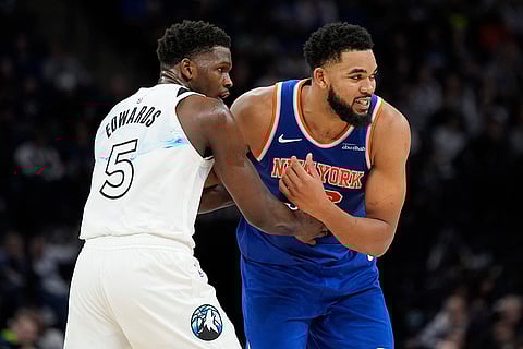 NBA: Knicks center Karl-Anthony Towns (32) is guarded by Timberwolves guard Anthony Edwards