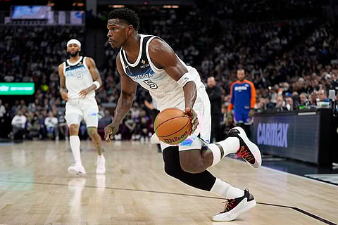 NBA: imberwolves guard Anthony Edwards (5) works toward the basket