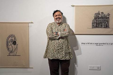 Glimpses: Devdutt Pattanaik with his exhibit at the Biennale