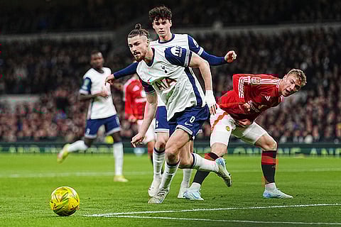 EFL Cup Quarter-Finals: Tottenham's Archie Gray and Radu Dragusin challenges for the ball with Manchester United's Rasmus Hojlund