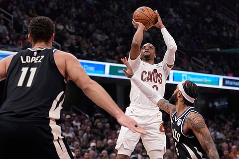 NBA 2024-25: Cavaliers guard Darius Garland shoots in front of Milwaukee Bucks center Brook Lopez