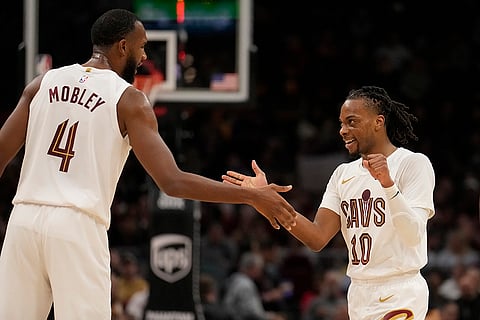NBA 2024-25: Cavaliers guard Darius Garland (10) celebrates with teammate Evan Mobley