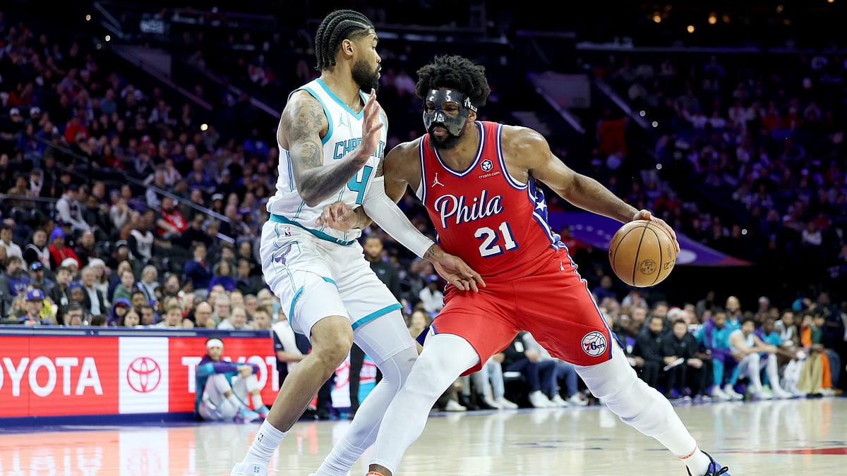 Joel Embiid #21 of the Philadelphia 76ers drives against Nick Richards #4 of the Charlotte Hornets during the first half at the Wells Fargo Center on December 20, 2024 in Philadelphia, Pennsylvania.