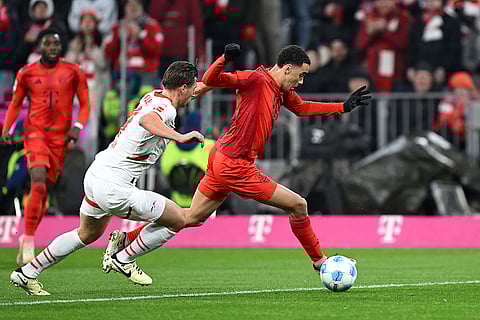 Bundesliga 2024-25: Munich's Jamal Musiala and Leipzig's Willi Orban in action