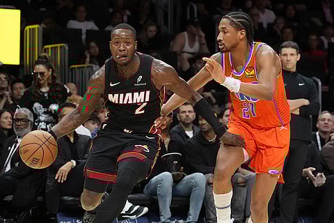 NBA 2024-25: Thunder guard Aaron Wiggins (21) defends Heat guard Terry Rozier