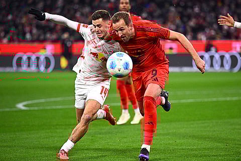 Bundesliga 2024-25: Munich's Harry Kane vies for the ball against Leipzig's Christoph Baumgartner