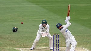 AP Photo/Pat Hoelscher : India's Akash Deep plays a shot during play on day five of the third cricket test between India and Australia at the Gabba in Brisbane.
