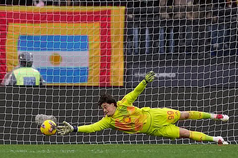 Serie A 2024-25: Roma goalkeeper Mile Svilar dives to reach for the ball
