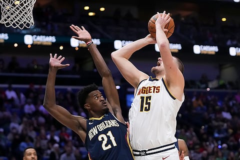 NBA 2024-25: Nuggets center Nikola Jokic (15) goes to the basket against New Orleans Pelicans