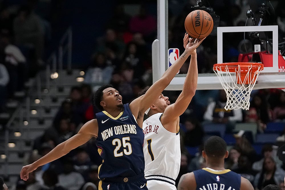| Photo: AP/Gerald Herbert : NBA 2024-25: New Orleans Pelicans guard Trey Murphy III (25) leaps for the ball 