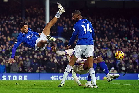 EPL 2024-25: Chelsea's Tosin Adarabioyo blocks a shot as Everton's Beto and Iliman Ndiaye, left, try to get out of the way