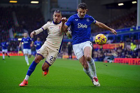 EPL 2024-25: Chelsea's Malo Gusto and Everton's James Tarkowski (right) battle for the ball