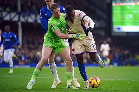 EPL 2024-25: Everton goalkeeper Jordan Pickford and Chelsea's Nicolas Jackson (right) battle for the ball