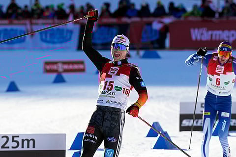 Austria Nordic Combined World Cup: Vinzenz Geiger, of Germany, crosses the finish line in first place, ahead of Ilkka Herola, of Finland