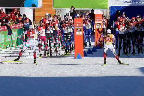 Austria Nordic Combined World Cup: Jarl Magnus Riiber, of Norway, right, and Jens Luraas Oftebro, left, also of Norway, start the ross-country race