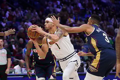 NBA 2024-25: Nuggets forward Michael Porter Jr. (1) drives to the basket
