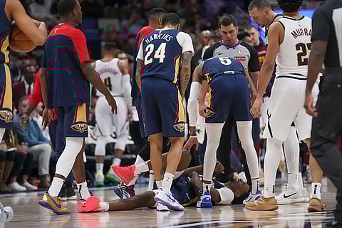 NBA 2024-25: Pelicans forward Herbert Jones lies on the court after a hard foul