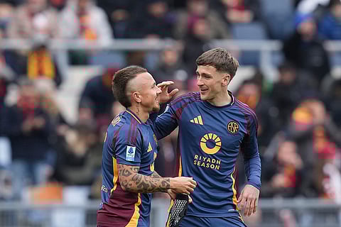 Serie A 2024-25: Roma's Alexis Saelemaekers, right, celebrates after scoring his side's second goal