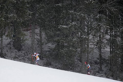 Austria Nordic Combined World Cup: Ida Marie Hagen, of Norway, left, skis uphill ahead of Nathalie Armbruster, of Germany