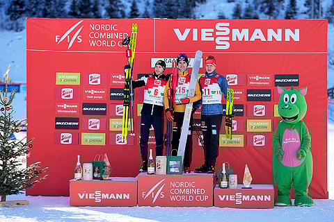 Austria Nordic Combined World Cup: Second placed Ilkka Herola, of Finland, winner Vinzenz Geiger, of Germany, and third placed Julian Schmid, of Germany, from left, pose on the podium