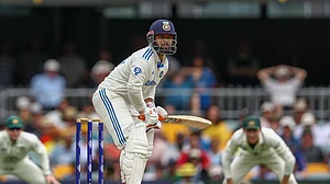 AP Photo/Pat Hoelscher : India's Rishabh Pant bats during play on day three of the third cricket test between India and Australia at the Gabba in Brisbane.