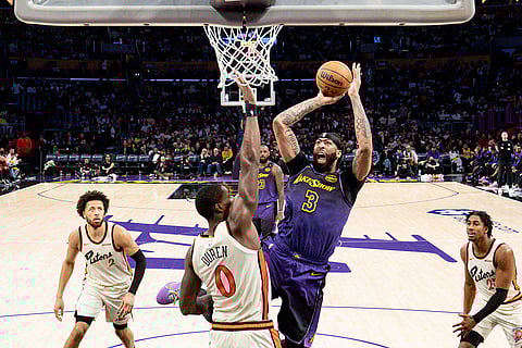 NBA 2024-25: Lakers forward Anthony Davis shoots over Pistons center Jalen Duren