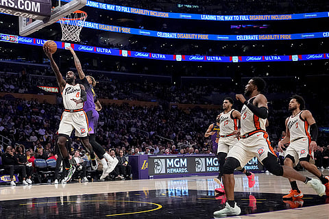 NBA 2024-25: Pistons forward Tim Hardaway Jr. (8) goes to the basket against Lakers guard D'Angelo Russell