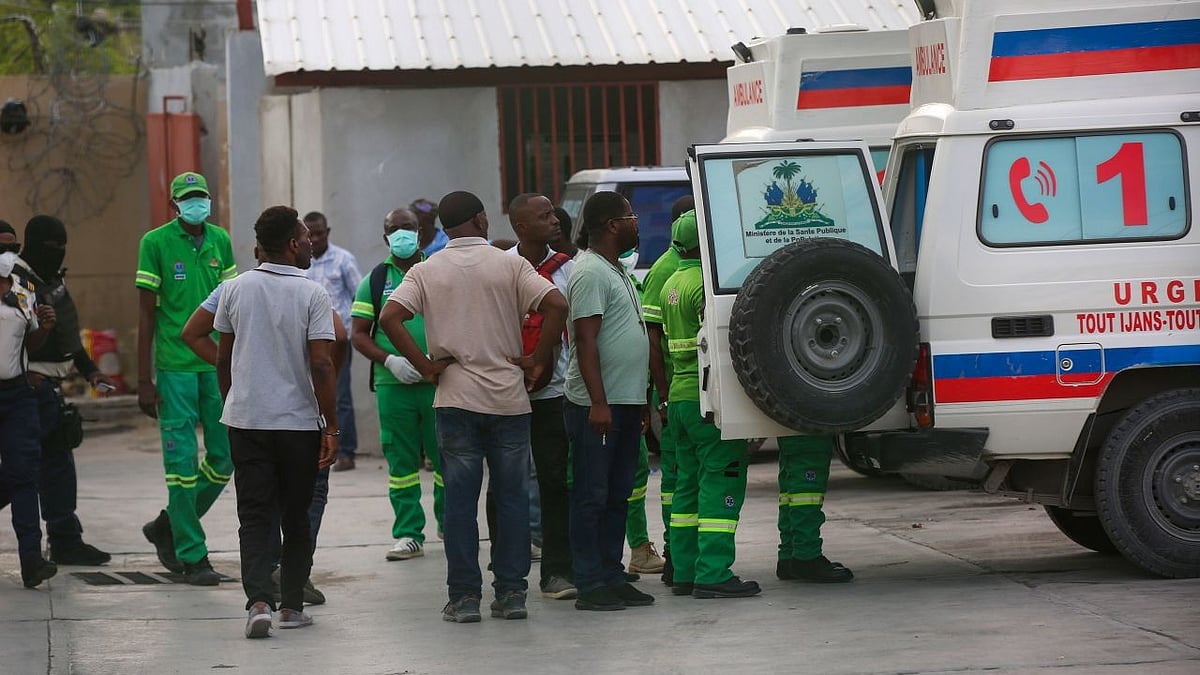| Odelyn Joseph/AP : Medics inspect an ambulance of wounded people, shot by armed gangs at the General Hospital, in Port-au-Prince, Haiti, on Tuesday, December 24.