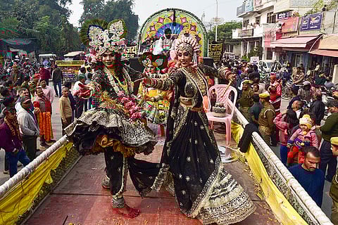 Artists perform during the 'Peshwai' procession