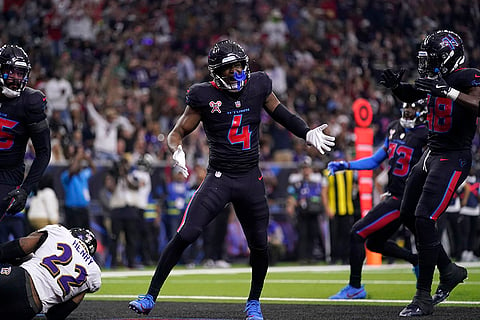 NFL Football: Texans cornerback Kamari Lassiter (4) celebrates after tackling Ravens running back Derrick Henry