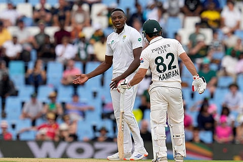 SA vs PAK 1st Test Day 1: South Africa's Kagiso Rabada, left, exchanges words with Pakistan's Kamran Ghulam
