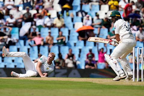 SA vs PAK 1st Test Day 1: South Africa's Corbin Bosch, left, falls down after his delivery