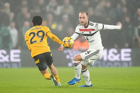 EPL 2024-25: Wolves Goncalo Guedes, left, and Manchester United's Christian Eriksen challenge for the ball
