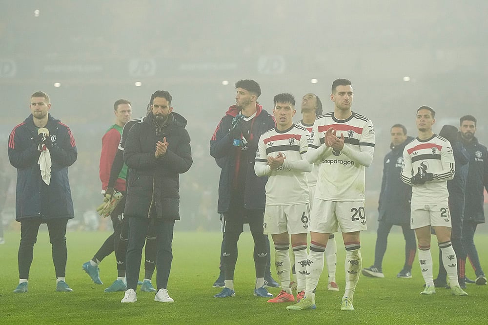 | Photo: Nick Potts/PA via AP : EPL 2024–25: Ruben Amorim, manager of Manchester United, second from left, and his team cheer on the supporters