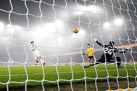 EPL 2024-25: Wolves Hwang Hee-Chan, centre, scores his side's second goal