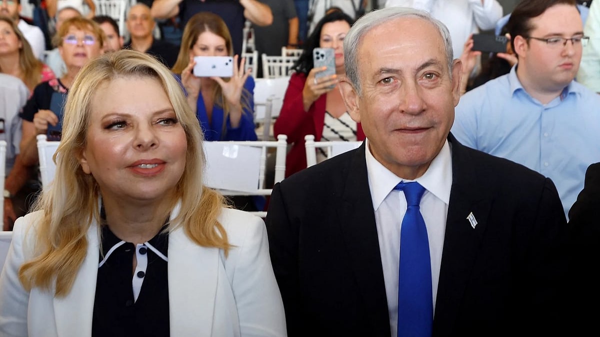 | Photo-  Amir Cohen/Reuters/File : Israeli Prime Minister Benjamin Netanyahu, flanked by his wife Sara Netanyahu, attends an inauguration event for Israel's new light rail line for the Tel Aviv metropolitan area, in Petah Tikva, Israel, August 17, 2023