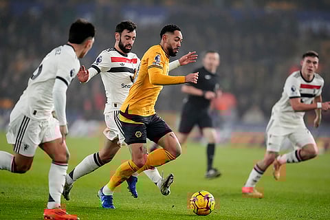 EPL 2024-25: Manchester United's Bruno Fernandes, centre left, fouls Wolves Matheus Cunha