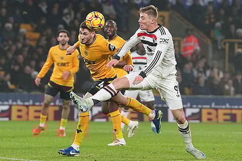 EPL 2024-25: Manchester United's Rasmus Hojlund, right, and Wolves Santiago Bueno challenge for the ball
