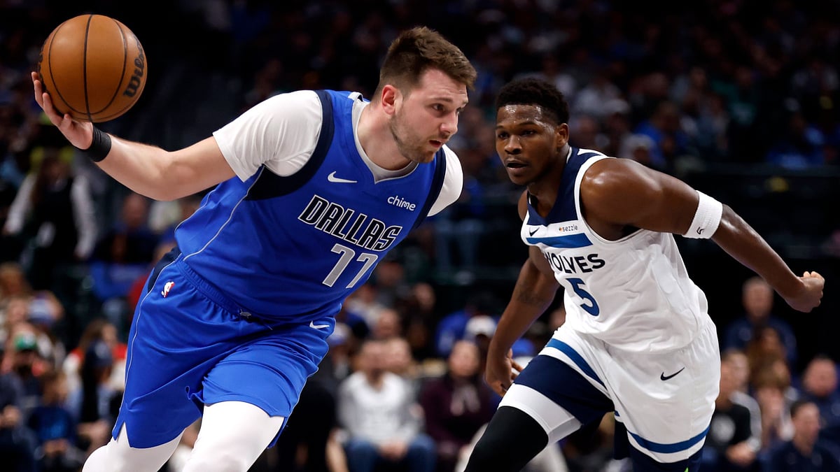 Luka Doncic #77 of the Dallas Mavericks drives inside as Anthony Edwards #5 of the Minnesota Timberwolves defends in the first half at American Airlines Center on December 25, 2024 in Dallas, Texas. - null
