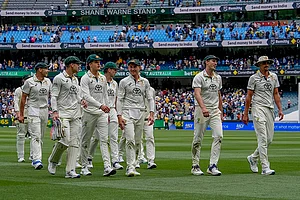 | Photo: AP/Asanka Brendon Ratnayake : India Vs Australia, 4th Test Day 2: Australian players walk off the field on the end of play